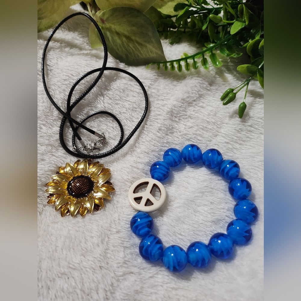 Handmade sunflower necklace and blue beaded bracelet with peace sign
